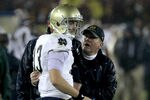 LOS ANGELES - NOVEMBER 27: Head coach Brian Kelly and quarterback Tommy Rees #13 of the Notre Dame Fighting Irish talk during the final clock killing possession in the fourth quarter against the USC Trojans at the Los Angeles Memorial Coliseum on November 27, 2010 in Los Angeles, California.  Notre Dame won 20-16.  (Photo by Stephen Dunn/Getty Images)