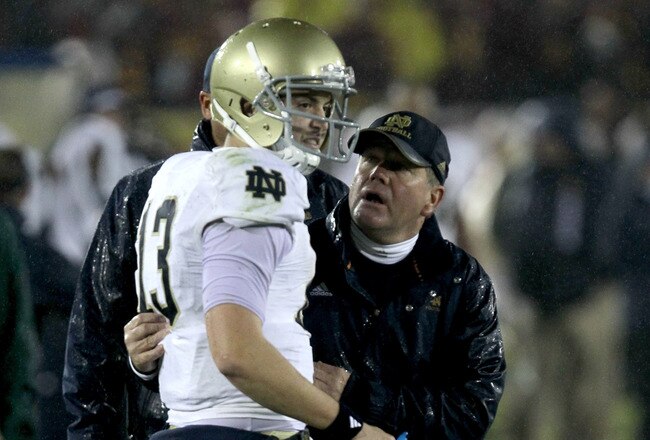 LOS ANGELES - NOVEMBER 27: Head coach Brian Kelly and quarterback Tommy Rees #13 of the Notre Dame Fighting Irish talk during the final clock killing possession in the fourth quarter against the USC Trojans at the Los Angeles Memorial Coliseum on November 27, 2010 in Los Angeles, California.  Notre Dame won 20-16.  (Photo by Stephen Dunn/Getty Images)