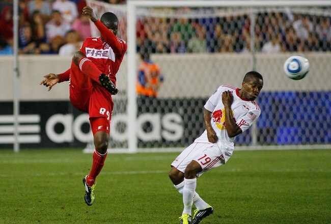 HARRISON, NJ - AUGUST 13: Yamith Cuesta #89 of the Chicago Fire plays the ball as Dane Richards #19 of the New York Red Bulls just eludes getting hit during the game at Red Bull Arena on August 13, 2011 in Harrison, New Jersey. (Photo by Andy Marlin/Getty Images)