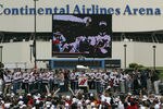 EAST RUTHERFORD, NJ - JUNE 14:  Members of the New Jersey Devils present the Stanley Cup as the Devils celebrate their Stanley Cup championship with their fans in the parking lot at the Continental Airlines Arena on June 14, 2003 in East Rutherford, New Jersey. The Devils defeated the Ducks in seven games to win the Stanley Cup. (Photo by Doug Pensinger/Getty Images/NHLI)
