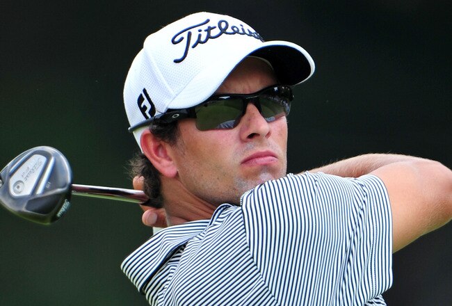 JOHNS CREEK, GA - AUGUST 13:  Adam Scott of Australia hits his tee shot on the second hole during the third round of the 93rd PGA Championship at the Atlanta Athletic Club on August 13, 2011 in Johns Creek, Georgia.  (Photo by Stuart Franklin/Getty Images)