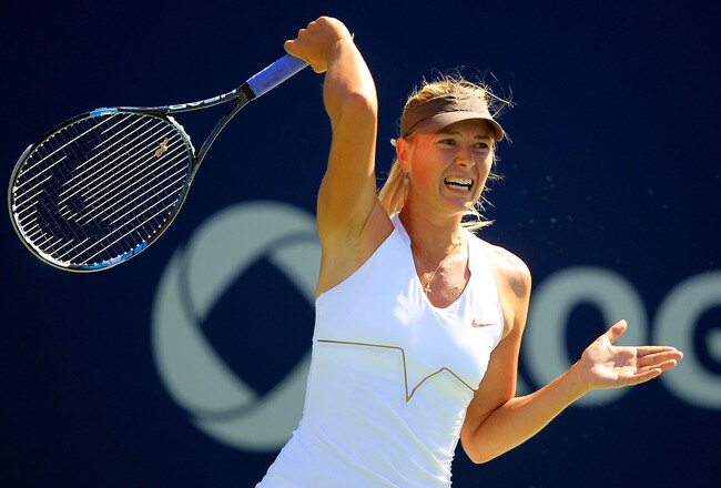 TORONTO, ON - AUGUST 11:  Maria Sharapova of Russia returns to Galina Voskoboeva of Kazakhstan on Day 4 of the Rogers Cup presented by National Bank at the Rexall Centre on August 11, 2011 in Toronto, Ontario, Canada.  (Photo by Chris Trotman/Getty Images)