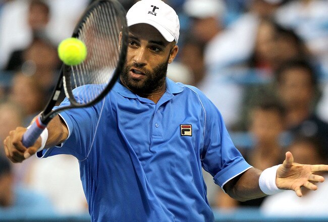 WASHINGTON, DC - AUGUST 04:  James Blake returns a shot to John Isner during the Legg Mason Tennis Classic presented by Geico at the William H.G. FitzGerald Tennis Center on August 4, 2011 in Washington, DC.  (Photo by Matthew Stockman/Getty Images)