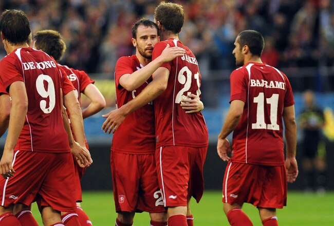 ARNHEM, NETHERLANDS - JULY 26:  Marc Janko (C) of FC Twente celebrates with his team mates after scoring during the Champions League third qualifying round between FC Twente and FC Vaslui at Gelredome on July 26, 2011 in Arnhem, Netherlands.  (Photo by Valerio Pennicino/Getty Images)