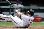 BALTIMORE, MD - AUGUST 14:  J.J. Hardy #2 of the Baltimore Orioles slips and falls after swinging and missing a pitch during the game against the Detroit Tigers at Oriole Park at Camden Yards on August 14, 2011 in Baltimore, Maryland.  (Photo by Greg Fiume/Getty Images)