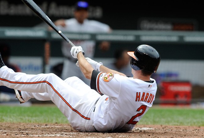 BALTIMORE, MD - AUGUST 14:  J.J. Hardy #2 of the Baltimore Orioles slips and falls after swinging and missing a pitch during the game against the Detroit Tigers at Oriole Park at Camden Yards on August 14, 2011 in Baltimore, Maryland.  (Photo by Greg Fiume/Getty Images)