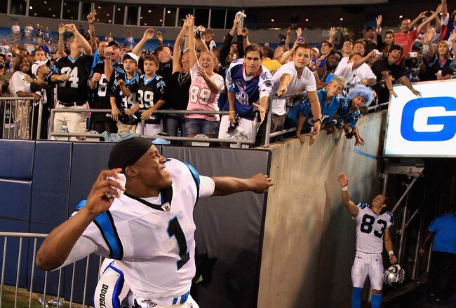 CHARLOTTE, NC - AUGUST 13:  Cam  Newton #1 of the Carolina Panthers throws his arm bands into the crowd after defeating the New York Giants 20-10 at Bank of America Stadium on August 13, 2011 in Charlotte, North Carolina.  (Photo by Streeter Lecka/Getty Images)