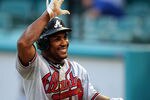 MIAMI GARDENS, FL - AUGUST 10:  Jose Constanza #17 of the Atlanta Braves celebrates scoring a run against the Florida Marlins at Sun Life Stadium on August 10, 2011 in Miami Gardens, Florida.  (Photo by Marc Serota/Getty Images)