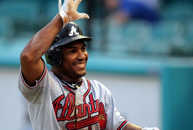MIAMI GARDENS, FL - AUGUST 10:  Jose Constanza #17 of the Atlanta Braves celebrates scoring a run against the Florida Marlins at Sun Life Stadium on August 10, 2011 in Miami Gardens, Florida.  (Photo by Marc Serota/Getty Images)
