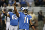 DETROIT - JANUARY 03:  Daunte Culpepper #11 of the Detroit Lions celebrates a fourth quarter touchdown while playing the Chicago Bears on January 3, 2010 at Ford Field in Detroit, Michigan. Chicago won the game 23-37. (Photo by Gregory Shamus/Getty Images)