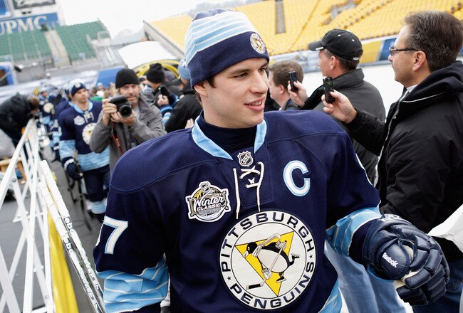 PITTSBURGH, PA - DECEMBER 31:  Sidney Crosby #87 of the Pittsburgh Penguins is greeted by fans while walking out to the rink for practice ahead of the 2011 NHL Winter Classic between the Penguins and the Washington Capitals on December 31, 2010 at Heinz Field in Pittsburgh, Pennsylvania.  (Photo by Jamie Squire/Getty Images)