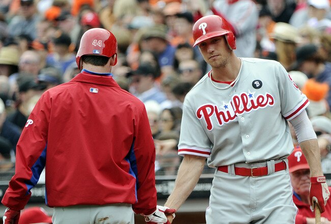 SAN FRANCISCO, CA - AUGUST 7: Roy Oswalt #44 of the Philadelphia Phillies celebrates with Hunter Pence #3 after scoring on a Chase Utley RBI single against the San Francisco Giants in the third inning during a MLB baseball game at AT&T Park August 7, 2011 in San Francisco, California. (Photo by Thearon W. Henderson/Getty Images)