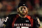 LUBBOCK, TX - NOVEMBER 08:  Quarterback Taylor Potts #15 of the Texas Tech Red Raiders during play against the Oklahoma State Cowboys at Jones AT&T Stadium on November 8, 2008 in Lubbock, Texas.  (Photo by Ronald Martinez/Getty Images)