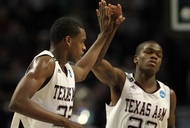 CHICAGO, IL - MARCH 18:  Khris Middleton #22 of the Texas A&M Aggies celebrates with teammate Naji Hibbert #23 after making a three-pointer at the buzzer in the first half of the game against the Florida State Seminoles during the second round of the 2011 NCAA men's basketball tournament at the United Center on March 18, 2011 in Chicago, Illinois.  (Photo by Jamie Squire/Getty Images)