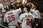 DETROIT, MI - AUGUST 15:  DH, Jim Thome #25 of the Minnesota Twins high-fives teammates in the dug-out after hitting his first home run against the Detroit Tigers during a MLB game at Comerica Park on August 15, 2011 in Detroit, Michigan.  The Twins won 9-6  (Photo by Dave Reginek/Getty Images)