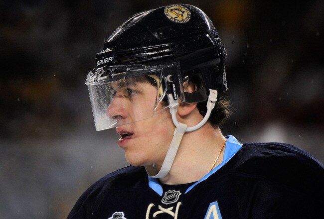 PITTSBURGH, PA - JANUARY 01:  Evgeni Malkin #71 of the Pittsburgh Penguins looks on during the third period of the game against the Washington Capitals at the 2011 NHL Bridgestone Winter Classic at Heinz Field on January 1, 2011 in Pittsburgh, Pennsylvania. Washington won 3-1.  (Photo by Jamie Sabau/Getty Images)