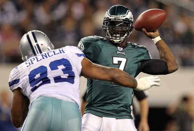 ARLINGTON, TX - DECEMBER 12:  Quarterback Michael Vick #7 of the Philadelphia Eagles drops back to pass against Anthony Spencer #93 of the Dallas Cowboys at Cowboys Stadium on December 12, 2010 in Arlington, Texas.  (Photo by Ronald Martinez/Getty Images)