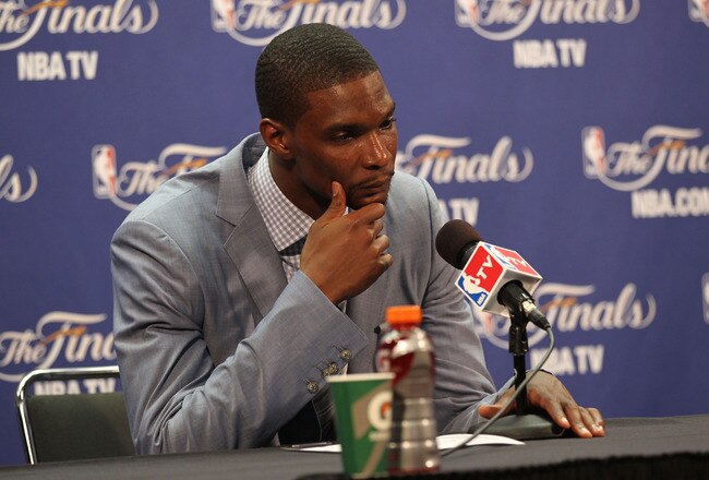 MIAMI, FL - JUNE 12:  Chris Bosh #1 of the Miami Heat answers questions from the media at a post game press conference after the Dallas Mavericks won 105-95 in Game Six of the 2011 NBA Finals at American Airlines Arena on June 12, 2011 in Miami, Florida. NOTE TO USER: User expressly acknowledges and agrees that, by downloading and/or using this Photograph, user is consenting to the terms and conditions of the Getty Images License Agreement.  (Photo by Mike Ehrmann/Getty Images)