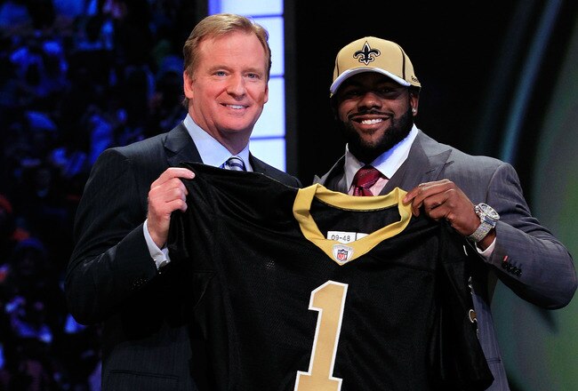 NEW YORK, NY - APRIL 28:  NFL Commissioner Roger Goodell (L) poses for a photo with Mark Ingram, #28 overall pick by the New Orleans Saints, holds up a jersey on stage during the 2011 NFL Draft at Radio City Music Hall on April 28, 2011 in New York City.  (Photo by Chris Trotman/Getty Images)