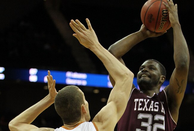 KANSAS CITY, MO - MARCH 11:  Kourtney Roberson #32 of the Texas A&M Aggies goes up for a shot against Matt Hill #21 of the Texas Longhorns during their semifinal game in the 2011 Phillips 66 Big 12 Men's Basketball Tournament at Sprint Center on March 11, 2011 in Kansas City, Missouri.  (Photo by Jamie Squire/Getty Images)