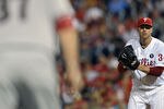 PHILADELPHIA, PA - AUGUST 16: Roy Halladay #34 of the Philadelphia Phillies keeps an eye on Lyle Overbay #37 of the Arizona Diamondbacks in the ninth inning at Citizens Bank Park on August 16, 2011 in Philadelphia, Pennsylvania. The Diamondbacks won 3-2. (Photo by Drew Hallowell/Getty Images)
