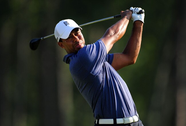 JOHNS CREEK, GA - AUGUST 12:  Tiger Woods hits a tee shot during the second round of the 93rd PGA Championship at the Atlanta Athletic Club on August 12, 2011 in Johns Creek, Georgia.  (Photo by Stuart Franklin/Getty Images)