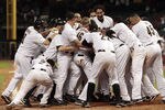 HOUSTON - AUGUST 16:  The Houston Astros celebrates with Brian Bogusevic #19 after hitting  walk-off grand slam home run  in the ninth inning against the Chicago Cubs to win 6-5 at Minute Maid Park on August 16, 2011 in Houston, Texas.  (Photo by Bob Levey/Getty Images)