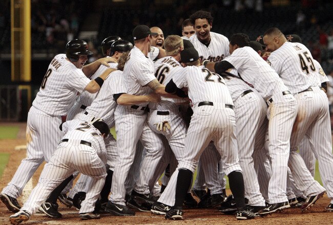 HOUSTON - AUGUST 16:  The Houston Astros celebrates with Brian Bogusevic #19 after hitting  walk-off grand slam home run  in the ninth inning against the Chicago Cubs to win 6-5 at Minute Maid Park on August 16, 2011 in Houston, Texas.  (Photo by Bob Levey/Getty Images)