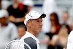 MONTREAL, QC - AUGUST 10: Nikolay Davydenko of Russia congratulates Novak Djokovic of Serbia after their match during the Rogers Cup at Uniprix Stadium on August 10, 2011 in Montreal, Canada.  (Photo by Matthew Stockman/Getty Images)