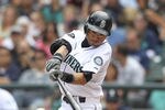 SEATTLE - AUGUST 14:  Ichiro Suzuki #51 of the Seattle Mariners singles in the fifth inning against the Boston Red Sox at Safeco Field on August 14, 2011 in Seattle, Washington. (Photo by Otto Greule Jr/Getty Images)