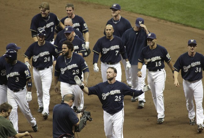 MILWAUKEE, WI - AUGUST 16: Mark Kotsay #25 of the Milwaukee Brewers celebrates after hitting the game winning RBI single against the Los Angeles Dodgers in the ninth inning at a Major League Baseball game at Miller Park Stadium on August 16, 2011 in Milwaukee, Wisconsin.  Brewers beat the dodgers 2-1. (Photo by Darren Hauck/Getty Images)