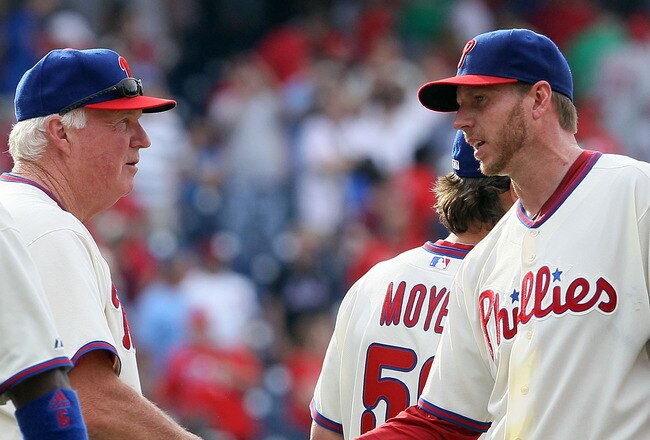PHILADELPHIA - MAY 01:  Roy Halladay #34 and manager Charlie Manuel of the Philadelphia Phillies celebrate after defeating the New York Mets at Citizens Bank Park on May 1, 2010 in Philadelphia, Pennsylvania.  (Photo by Jim McIsaac/Getty Images)