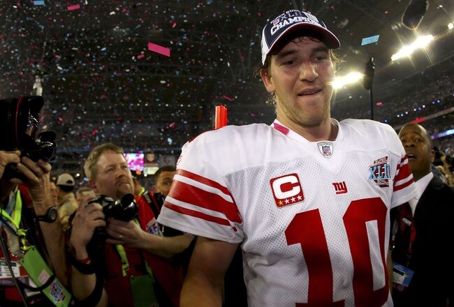 GLENDALE, AZ - FEBRUARY 03:  Quarterback Eli Manning #10 of the New York Giants walks off the field after the Giants defeated the New England Patriots 17-14 during Super Bowl XLII on February 3, 2008 at the University of Phoenix Stadium in Glendale, Arizona.  (Photo by Donald Miralle/Getty Images)