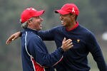 SAN FRANCISCO - OCTOBER 11:  Fred Couples the Captain of the USA Team races to congratulate Tiger Woods after he had holed the winning putt at the 13th hole where he beat his opponent Y.E.Yang 6&5 during the Day Four Singles Matches in The Presidents Cup at Harding Park Golf Course on October 11, 2009 in San Francisco, California  (Photo by David Cannon/Getty Images)