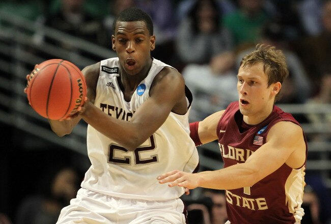 CHICAGO, IL - MARCH 18: Khris Middleton #22 of the Texas A&M Aggies controls the ball against Deividas Dulkys #4 of the Florida State Seminoles in the first half during the second round of the 2011 NCAA men's basketball tournament at the United Center on March 18, 2011 in Chicago, Illinois.  (Photo by Jamie Squire/Getty Images)