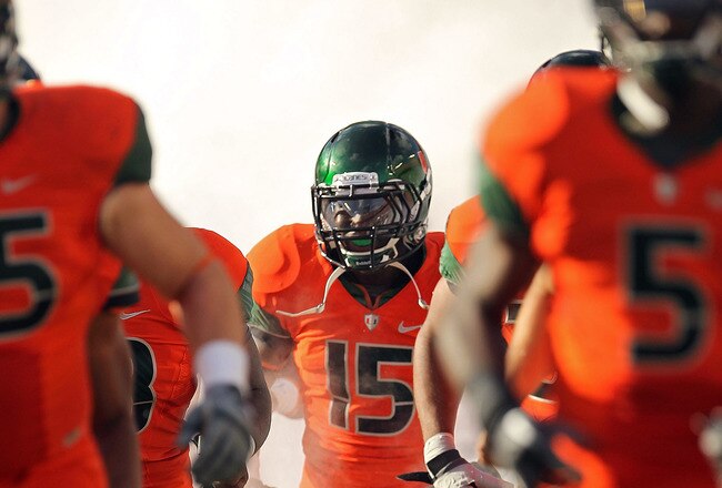 MIAMI - NOVEMBER 20: Jamal Reid #15 of the Miami Hurricanes runs out of the tunnel during a game against the Virginia Tech Hokies at Sun Life Stadium on November 20, 2010 in Miami, Florida.  (Photo by Mike Ehrmann/Getty Images)