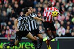 SUNDERLAND, ENGLAND - JANUARY 16: Newcastle defenders Mike Williamson (L) and Danny Simpson challenge Sunderland forward Asamoah Gyan during the Barclays Premier League match between Sunderland and Newcastle United at Stadium of Light on January 16, 2011 in Sunderland, England. (Photo by Stu Forster/Getty Images)