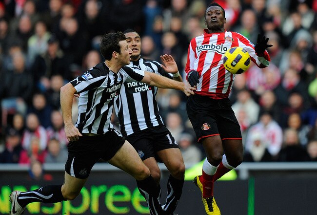 SUNDERLAND, ENGLAND - JANUARY 16: Newcastle defenders Mike Williamson (L) and Danny Simpson challenge Sunderland forward Asamoah Gyan during the Barclays Premier League match between Sunderland and Newcastle United at Stadium of Light on January 16, 2011 in Sunderland, England. (Photo by Stu Forster/Getty Images)