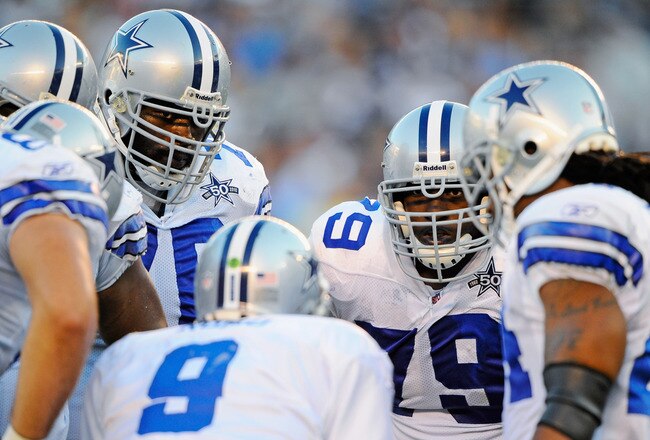 SAN DIEGO - AUGUST 21:  Robert Brewster #79 of the Dallas Cowboys listens to quarterback Tony Romo #9 as they huddle during the pre-season NFL football game against San Diego Chargers at Qualcomm Stadium on August 21, 2010 in San Diego, California.  (Photo by Kevork Djansezian/Getty Images)