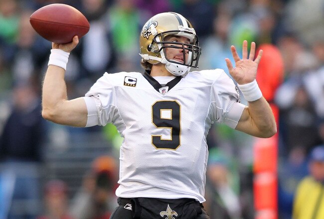 SEATTLE, WA - JANUARY 08:  Quarterback Drew Brees #9 of the New Orleans Saints throws the ball against the Seattle Seahawks during the 2011 NFC wild-card playoff game at Qwest Field on January 8, 2011 in Seattle, Washington.  (Photo by Jonathan Ferrey/Getty Images)