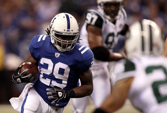 INDIANAPOLIS, IN - JANUARY 08:  Joseph Addai #29 of the Indianapolis Colts runs the ball against the New York Jets during their 2011 AFC wild card playoff game at Lucas Oil Stadium on January 8, 2011 in Indianapolis, Indiana.  The Jets won 17-16. (Photo by Jonathan Daniel/Getty Images)