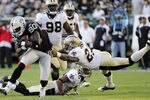 OAKLAND, CA - AUGUST 28: Derek Hagan #80 of the Oakland Raiders breaks the tackle of Malcolm Jenkins #27 of the New Orleans Saints in the third quarter during an NFL pre-season football game at the O.co Coliseum August 28, 2011 in Oakland, California. (Photo by Thearon W. Henderson/Getty Images)