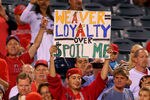 ANAHEIM, CA - AUGUST 24:  A fan of the Los Angeles Angels of Anaheim holds up praising starting pitcher Jered Weaver #36 of the Los Angeles Angels of Anaheim (not in photo) after the Angel's 8-0 win against the Chicago White Sox in the MLB game at Angel Stadium of Anaheim on August 24, 2011 in Anaheim, California. Weaver recently signed a 5-year $85 million contract with the Los Angeles Angels of Anaheim.(Photo by Victor Decolongon/Getty Images)