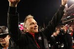 ATHENS, GA - NOVEMBER 27:  Head coach Mark Richt of the Georgia Bulldogs celebrates their 42-34 win over the Georgia Tech Yellow Jackets at Sanford Stadium on November 27, 2010 in Athens, Georgia.  (Photo by Kevin C. Cox/Getty Images)