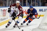UNIONDALE, NY - OCTOBER 16:  Kyle Quincey #27 of the Colorado Avalanche skates against Frans Nielsen #51 of the New York Islanders on October 16, 2010 at Nassau Coliseum in Uniondale, New York.  (Photo by Jim McIsaac/Getty Images)