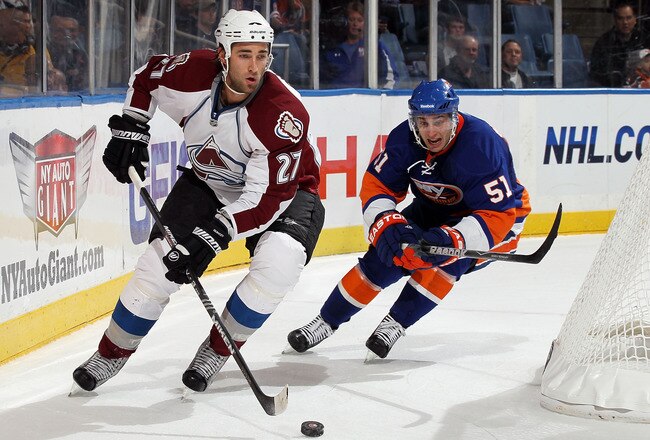 UNIONDALE, NY - OCTOBER 16:  Kyle Quincey #27 of the Colorado Avalanche skates against Frans Nielsen #51 of the New York Islanders on October 16, 2010 at Nassau Coliseum in Uniondale, New York.  (Photo by Jim McIsaac/Getty Images)