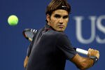 NEW YORK, NY - AUGUST 29:  Roger Federer of  Switzerland returns the ball against Santiago Giraldo of Colombia during Day One of the 2011 US Open at the USTA Billie Jean King National Tennis Center on August 29, 2011 in the Flushing neighborhood of the Queens borough of New York City.  (Photo by Julian Finney/Getty Images)