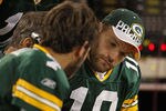 GREEN BAY, WI - AUGUST 26: (L-R) Graham Harrell #7, Aaron Rodgers #12 and Matt Flynn #10 of the Green Bay Packers look over plays on the bench during a preseason game against the Indianapolis Colts at Lambeau Field on August 26, 2010 in Green Bay, Wisconsin. The Packers defeated the Colts 59-24. (Photo by Jonathan Daniel/Getty Images)