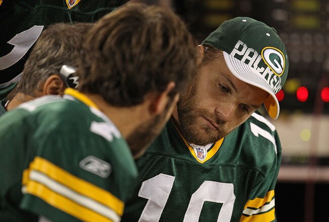 GREEN BAY, WI - AUGUST 26: (L-R) Graham Harrell #7, Aaron Rodgers #12 and Matt Flynn #10 of the Green Bay Packers look over plays on the bench during a preseason game against the Indianapolis Colts at Lambeau Field on August 26, 2010 in Green Bay, Wisconsin. The Packers defeated the Colts 59-24. (Photo by Jonathan Daniel/Getty Images)