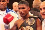 ATLANTIC CITY, NJ - MARCH 26: Yuriorkis Gamboa wears the championship belt after winning the IBF WBA World Featherweight title by beating Jorge Solis of Mexico during Top Rank's 'Featherweight Fury' on March 26, 2011 at Boardwalk Hall in Atlantic City, New Jersey. (Photo by Hunter Martin/Getty Images)